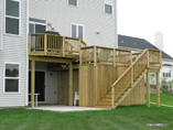 Two Level Deck with Storage Area Concrete Floor and Water Diversion System